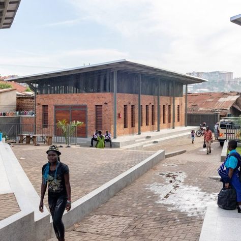 Steel canopies shade the spaces of the Kamwokya Community Centre in Kampala, Uganda, designed by Berlin studio Kéré Architecture. Sustainable Schools, Community Places, Butterfly Roof, Kampala Uganda, Canopy Architecture, Community Halls, Community Centre, Earth Homes, Architecture Design Concept