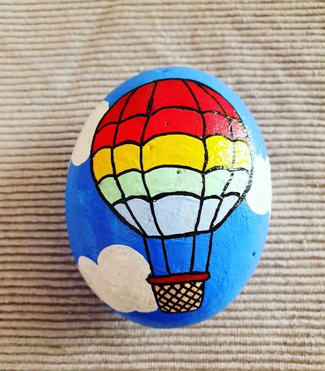 stone_of_heart_ Hot air balloon full of colours🌈 #paintedrocks #artsandcrafts #diy #acrylicpainting #rockartwork #rockspainting #paintingonrocks #rockpaintingideas #rockart #rockpainting Hot Air Balloon Rock Painting, Airplane Painted Rocks, Minion Rock, Rock Painting Flowers, Rock Band Painted Rocks, Summer Afternoon, Fabulous Diy, Rock Painting Ideas Easy, Rock Design