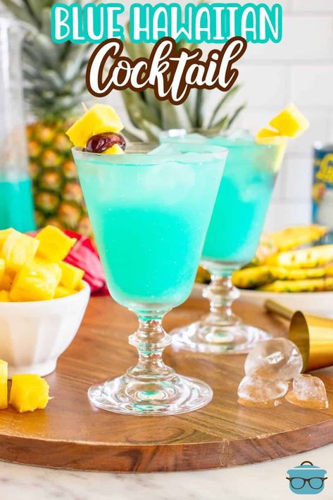 A blue Hawaiian cocktail in a glass. Blue Hawaiian Cocktail, Blue Hawaiian Punch, Hawaiian Cocktails, Baby Shower Punch, Singapore Sling, Jimmy Buffet, Cherry Cocktail, Hot Seat, Hawaii Party