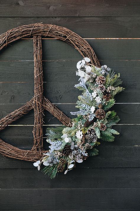 Peace Sign Wreath with Faux Foliage DIY. Put a modern twist on a classic grapevine wreath with faux flowers. It's the perfect large wreath to hang outdoors all winter long. #peacesign #wreath #diywreath #christmas #diy #holidays #christmasDIY #holidayDIY #grapevinewreath #fakeflowers #fauxflowers Peace Sign Wreath Diy, Peace Sign Wreath, Flower Arranging Tutorial, Holiday Table Settings, Fabulous Diy, Happy Friday Everyone, Large Wreath, Wreath Diy, Christmas Arrangements