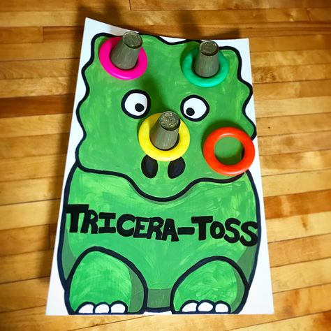 Tricera-toss dinosaur ring toss party game Dinosaur Party Games, Dinosaur Game, Dinosaur Activities Preschool, Dinosaur Birthday Theme, Dinosaur Ring, Girl Dinosaur Birthday, Dinosaur Birthday Party Decorations, Dinosaur Games, Dinosaur Themed Birthday Party