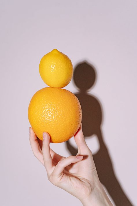 Person Holding Orange Citrus Fruit · Free Stock Photo Fruit Photography People, Hands Peeling Orange Reference, Hand Holding Fruit, Fruit Editorial Photography, Citrus Still Life Photography, Orange Photography Fruit, Orange Fruit Photo, Hand Held Food, Holding Fruit