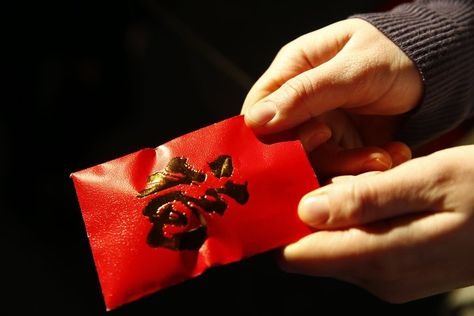 What&#8217;s the significance of Lunar New Year red envelopes? | The Seattle Times Lunar New Year Red Envelope, New Years Superstitions, Chinese Red Envelope, Inappropriate Gift, Feng Shui Principles, Happy New Year Gift, Seattle Travel, Lunar Year, Chinese Year