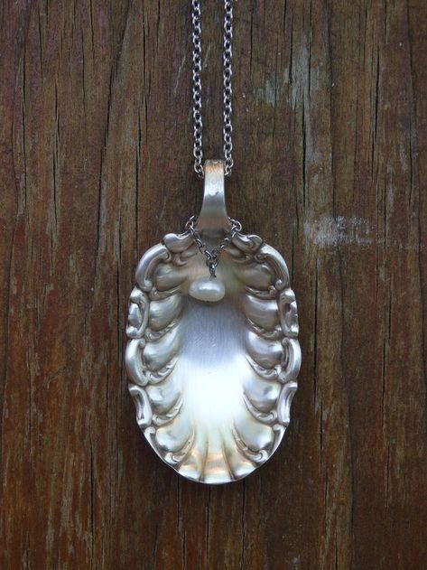 I created this unique necklace using an antique silver-plate sugar spoon I found at a antique shop I love taking antique silverware and giving it new life. This scalloped sugar spoon is truly beautiful and creates lovely one of a kind jewelry A fresh water pearl dangles in front of the spoon pendant Cutlery Crafts, Vintage Spoon Jewelry, Flatware Crafts, Spoon Pendant, Silver Spoon Jewelry, Silverware Crafts, Fork Jewelry, Flatware Jewelry, Silverware Art