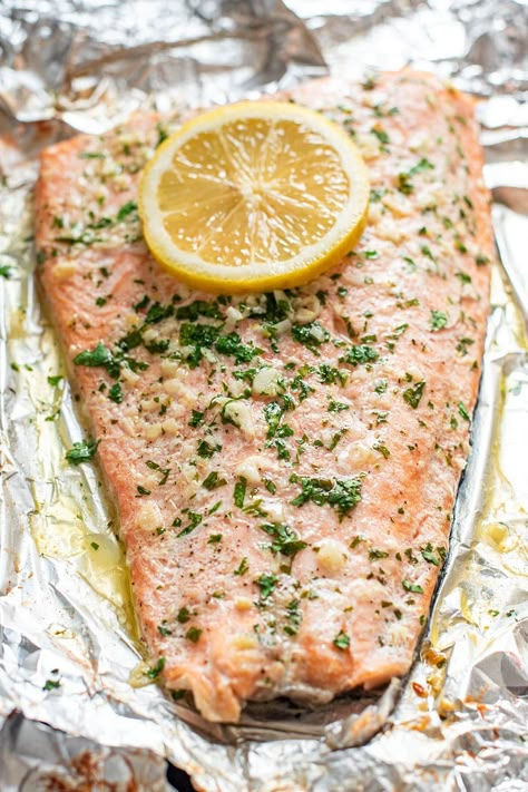 Garlic butter steelhead trout in foil is the easiest way to prepare trout. Season the fish with garlic, lemon, butter, salt, and pepper, and bake in foil for 20 minutes. Easy cleanup and super delicious #troutrecipes #steelheadtrout How To Cook Trout, Steelhead Trout Recipe Baked, Steelhead Trout Recipe, Trout Fillet Recipes, Grilled Trout, Trout Recipe, Haddock Recipes, Fish Entrees, Mediterranean Recipes Healthy