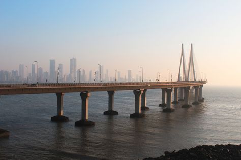 The Bandra–Worli Sea Link, officially called Rajiv Gandhi Sea Link, is a cable-stayed bridge with pre-stressed concrete-steel viaducts on either side that links Bandra in the Western Suburbs of Mumbai with Worli in South Mumbai.it is a dream city of thousands peoples and its also called bollywood city Mumbai Landscape Photography, Mumbai City Of Dreams, Mumbai Bridge, Mumbai Landscape, Worli Sea Link, Mumbai Aesthetic, Mumbai Skyline, Bandra Worli Sea Link, South Mumbai