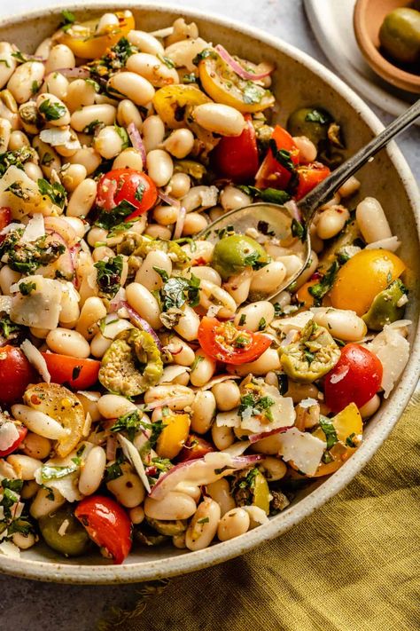 This vibrant and flavour-packed cannellini bean salad is THE simplest and most delicious white bean salad you'll ever eat. Quick and easy to make, it's packed with Mediterranean flavours, from juicy ripe tomatoes and Nocellara olives, to a tangy salsa verde. This bean salad is super healthy as it's packed full of nutrient-dense ingredients. High protein and high fibre, this salad will fill you up for longer too. | eatloveeats.com Cannellini Bean Salad, Cannellini Bean, Cold Salads, Lunch Party, High Fibre, White Bean Salad, Bean Salad Recipes, Superfood Salad, Mediterranean Salad