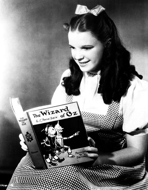 Judy Garland reading wizard of oz book Celebrities Reading, Wizard Of Oz 1939, Follow The Yellow Brick Road, Wonderful Wizard Of Oz, The Yellow Brick Road, The Wonderful Wizard Of Oz, People Reading, Land Of Oz, Somewhere Over The Rainbow