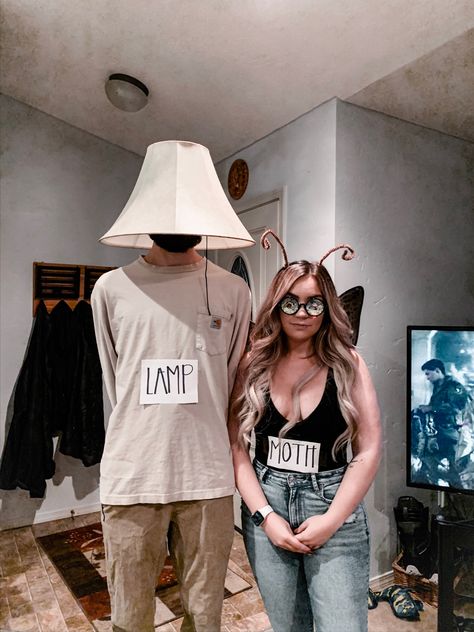 Couple wearing moth + lamp costumes Meme Couple Costume, Moth To A Flame Costume, Moth And Flame Costume, Moth And Lamp Halloween Costume, Halloween Costumes Couples Funny Unique, Lamp And Moth Costume, Butterfly Couple Costume, Moth Costume Women, Moth And Lamp Costume