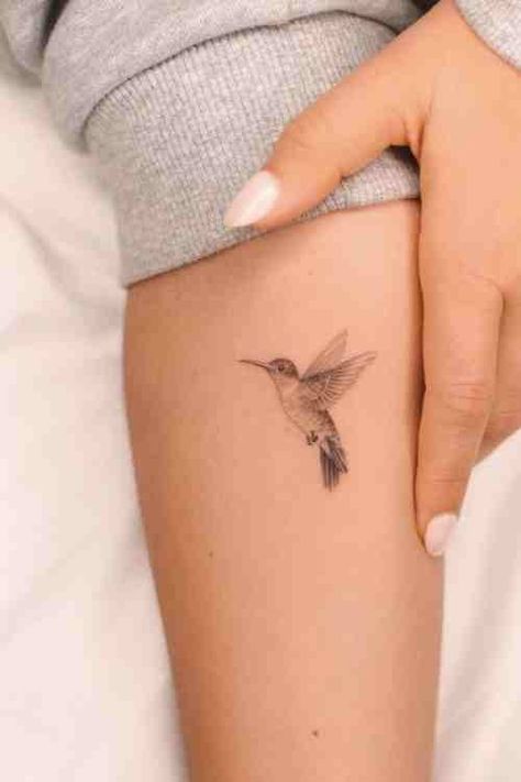 Tiny But Mighty - Hummingbird Tattoo Guide (70+ Examples!) - Tattoo Stylist Humming Bird And Flower Wrist Tattoo, Hummingbird Daffodil Tattoo, Hummingbird Tattoo Meaning For Women, Hummingbird Tattoo Ear, Fineline Tattoo Hummingbird, Hummingbird Sketch Tattoo, Hummingbird Feeder Tattoo, Hummingbird Wings Tattoo, One Line Hummingbird Tattoo