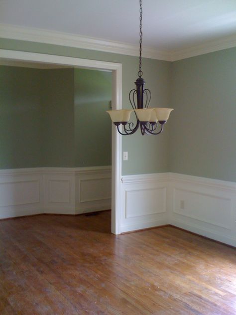 Sherwin Williams Softened Green and Dover White Green Walls White Wainscoting Living Room, Green Wall White Wainscoting, Morning Dew Sherwin Williams, Green Dining Room With White Wainscoting, Green Wall White Chair Rail, Light Green Dining Room Walls, White Wainscoting Green Walls, 2 Tone Dining Room Walls, Two Tone Dining Room Walls