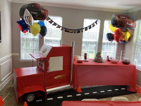 Mack truck snack table Mack Truck Birthday Party, Disney Cars Trunk Or Treat, Cara Birthday Party, Diy Monster Truck Birthday Decorations, Cars Mack Truck Diy, Cardboard Mack Truck, Disney Cars Mack Truck Table Diy, Cars And Monster Trucks Birthday, Semi Truck Birthday Cake Ideas