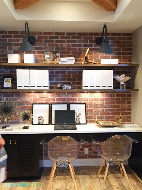 Omaha Street of Dreams Upstairs Desk Area - Life On Virginia Street Office Angled Ceiling, Office Ideas With Brick Wall, Brick Wall Home Office, Brick Wall Office Design, Brick Accent Wall Office, Office With Brick Wall, Office Brick Wall, Office Wall Lighting, Brick Office Space