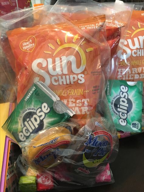 Treat bags containing Sun Chips, Eclipse gum, chocolate and banana mini Moon Pies, a Milky Way candy bar, and some Starburst candy. Solar Eclipse Treat Bags, Sun Chips, Starburst Candy, Eclipse Party, 2024 Eclipse, Moon Pies, Eclipse Of The Heart, Mini Moon, World Party