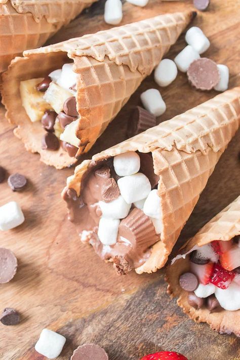 These Waffle Cone Smores are a fun treat any time of year. A summer twist on a fall treat or a fall twist on a summer treat – You decide! These Waffle Cone Smores are a delicious treat whichever way you cook them, but let's be honest - it's most fun to cook on the grill! Waffle Cone Smores, Cone Smores, Waffle Cone, Waffle Cones, Fall Treats, Treat You, Fun Treats, On The Grill, Cooking On The Grill