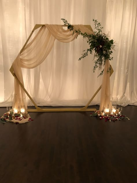 Altar Ideas Wedding Indoor, Arch With Lights Wedding, Diy Wedding Arch Drapery, Arbor With Draping, Wedding Arch Ideas Diy Indoor, Champagne Wedding Arch, Hexagon Background Wedding, How To Drape A Wedding Arch, Wedding Arch With Backdrop