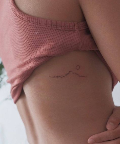 Minimalist mountain tattoo on the rib. Minimalist Mountain Tattoo, Small Mountain Tattoo, Berg Tattoo, 27 Tattoo, Mountain Tattoos, Small Rib Tattoos, International Tattoo, Rib Tattoos For Women, Minimalist Mountain