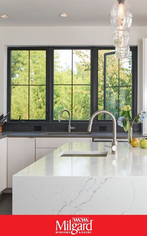 For a modern kitchen look try using black casement windows. The frames are bold and provide a beautiful contrast against the white walls, cabinets and kitchen island. Plus, the operating style allows both natural light and fresh air to come into the kitchen. Featuring UltraTM Series windows by Milgard Windows & Doors. #kitchenwindowideas #kitchenideas #homedecorideas #modernkitchenideas Colonial Grid Windows, Black Windows With Grids, Black Window Grids, Black Casement Windows, Modern Windows Exterior, Windows With Grids, Window Design Modern, Black Frame Windows, Casement Windows Exterior