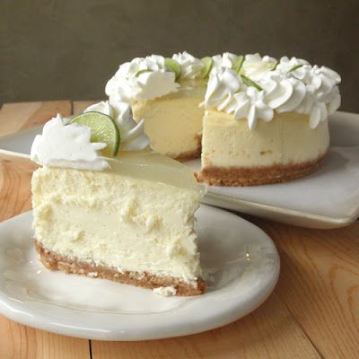 key lime cheesecake slice in front Cheesecake Factory Key Lime Pie, Cheesecake Recipes Key Lime, Best Key Lime Cheesecake Recipe, Cheesecake Factory Key Lime Cheesecake, Cheesecake Factory Cheesecake, Key Lime Cheesecake Recipe, Key Lime Pie Cheesecake, Key Lime Cheesecake, The Cheesecake Factory