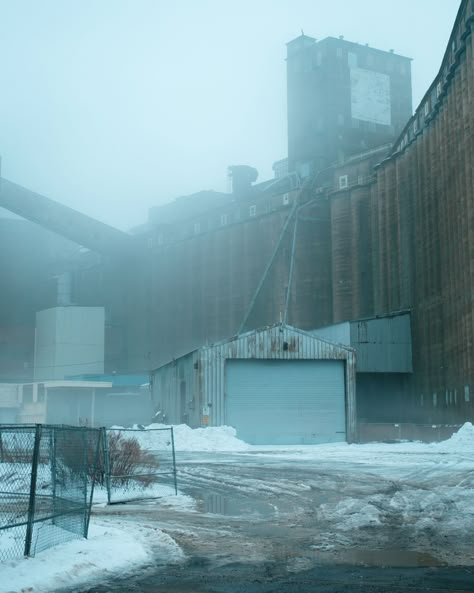 Abandoned industrial buildings at Silo City on a foggy winter day, Buffalo, New York Abandoned Industrial Buildings, Urban Hell, Foggy Winter, Abandoned Industrial, Abandoned City, Industrial City, Abandoned Factory, Red Bike, Rust Belt