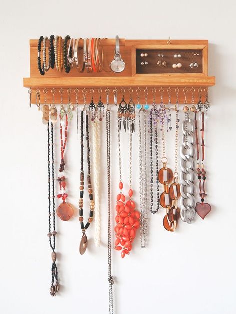 This is a wooden wall mounted jewellery organiser that is specifically made to declutter all your jewellery. No more tangled necklaces, mismatched earrings or lost bracelets! Have everything on display for us, ladies that are on the go!  Earrings holder - Bracelet holder - Jewellery holder - Necklace organiser - jewellery storage - jewelry holder - jewelry organizer - Necklace hanger - Wall mount jewelry holder - Necklace display Earrings Holder, Boho Jewelry Diy, Jewellery Organiser, Vintage Jewelry Diy, Diy Jewelry To Sell, Necklace Hanger, Wall Mount Jewelry Organizer, Bracelet Holder, Jewellery Holder