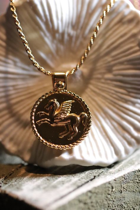 "This gorgeous vintage inspired Pegasus pendant, with an intricately braided trim, is named: \"True Self- Forgive me, for wanting to be free.\" The necklace is made from a thick layer of 24k gold, bounded with heat and pressure on top of sterling silver. This gold filled necklace will last decades with proper care.  The rope chain is 22 inches long, making it the perfect piece for layering and is flattering to any top necklines.  The \"True Self\" necklace is custom designed by Brightly and Lilian, a small business based in Calgary, Alberta. The brand creates jewelry that are meant to be cherished deeply, and their pieces symbolize the complexities and emotions of life. Feel free to check out their other meaningful pieces at www.brightlyandlilian.ca." Pegasus Necklace, Gold Filled Necklace, Art Deco Pendant, Story Board, Medallion Necklace, Calgary Alberta, True Self, Forgive Me, Be Free