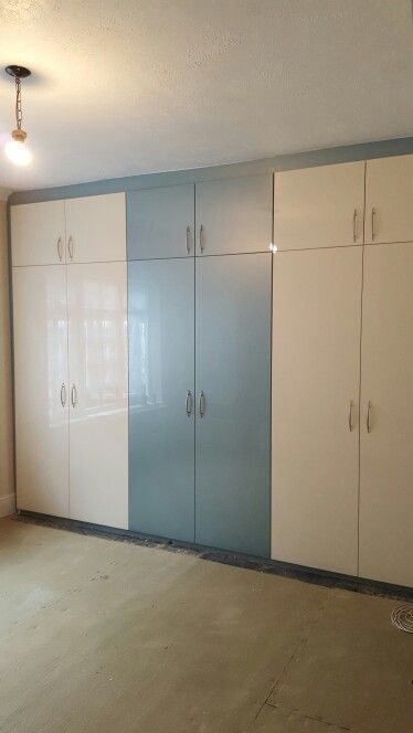 Acrylic Cream and Metallic Blue Fitted Wardrobes Cupboard Colour Ideas Bedroom, Bedroom Ideas Fitted Wardrobes, Wardrobe Design Bedroom Colour, Laminate Colours For Wardrobe, Blue Cupboards Bedroom, Acrylic Cupboard Designs, Acrylic Wardrobe Designs, Acrylic Wardrobe Design Bedroom, Wardrobe Colour Ideas Bedrooms