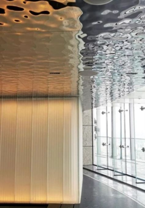 Water ripple stainless steel sheets are often used in interior ceilings. The water ripple pattern is reflected on the tile floor, giving the whole interior a shimmering effect.  #stainlesssteel #stainlesssteelsheet #decorativestainlesssteelsheet #waterripplestainlesssteelsheet #interiorceiling #ceilingdesign #ceilingdecor #interiordesign Water Ripple Stainless Steel, Canopy Ceiling, Colored Sheets, Ceiling Interior, Types Of Water, Light Refraction, Ripple Pattern, Steel Sheets, Facade Material