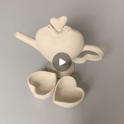 Mitu Haq on Instagram: "Turing two slab hearts into a HEART SHAPED TEAPOT ❤️❤️🫖 ❤️❤️ & it is perfectly functional, watch until the end to see it!!!!  • • • • • •  #bohemitu #clay #ceramic #porcelain #art #artofinstagram #handbuilding #sculpture #photography #ceramicart #stoneware #ceramicartist @potterforall #instapottery #potter #playwithclay #whiteclay #clayart #pots #ceramicbowls  #potteryvideos #ceramicmaking #ceramicist #friday #potterydemo #demos #claytutorials #ceramictutorial #pottery_lovers #potteryvideos" Slab Teapot, Sculpture Photography, Pottery Videos, Play Clay, Ceramic Porcelain, Porcelain Art, Clay Tutorials, White Clay, Ceramic Artists