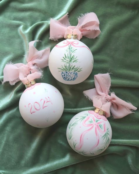 The first ornaments of the year are here!! They're perfect for remembering your milestone year or just celebrating your love of all things grandmillennial. The natural white base and pastel blue and pink are perfect against an evergreen Christmas tree. Comment ORNAMENT for the link! #grandmillennial #babysfirstchristmas #babyboy #babygirl #firstchristmas #firstchristmasornament #2024ornament Hand Painted Ball Ornaments, Baby Diy Ornaments, Clear Ornament Painting Ideas, Ornament Painting Ideas Ball, Preppy Ornaments, Decorating Ornaments Ideas, Coquette Ornaments, Monogram Ornaments Diy, Painted Ornaments Diy