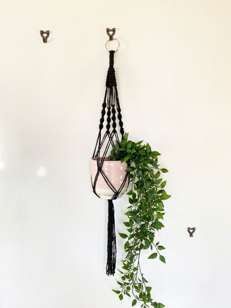 Black cotton macrame holder with a pink plant pit and a green faux plant Macro May Plant Holder, Spider Plant Macrame Hanger, Macrame Plant Hanger Disco Ball, Macrame Plant Hanger Black, Minimal Macrame Plant Hanger, Black Macrame, Macrame Plant Holder, Monochrome Color, Macrame Hanger