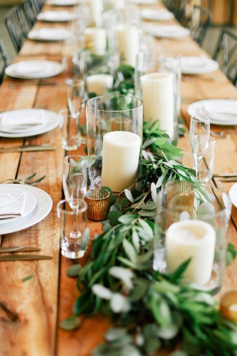 Rustic farm table with candles and greens draped down the table Wedding Table Garland, Long Table Wedding, Wedding Candles Table, Greenery Wedding Decor, Table Garland, Table Arrangements Wedding, Wedding Table Designs, Rustic Wedding Table, Wedding Floral Centerpieces