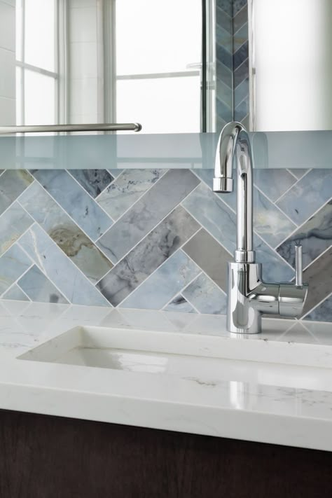 This blue bathroom tile is stunning! It's a above the sink backsplash design. Specifically it's moonstone marble herringbone tile. It's a luxury design for a modern contemporary bathroom. #bathroomtile #modernbathroom #colorfultile Backsplash For Blue Cabinets, Kitchen With Blue Backsplash, Bar Tile Backsplash, Blue Herringbone Backsplash, Blue Bathroom Tiles, Contemporary Bathroom Tiles, Blue Backsplash Kitchen, Marble Herringbone Tile, Sink Backsplash