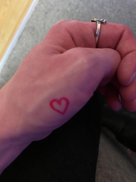 Pink heart mini small tattoo on hand thumb Heart Thumb Tattoo, Heart Tattoo On Thumb, White Heart Tattoo On Finger, Tiny Heart Hand Tattoo, Tattoo On Thumb, Small Heart Tattoo On Ring Finger, Heart Hand Tattoo, Heart Hands, Hand Tattoo