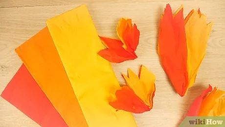 How to Make a Fake Fire: 14 Steps (with Pictures) - wikiHow Fake Fire Flames, How To Make Fake Fire With Tissue Paper, How To Make Flames Out Of Tissue Paper, Tissue Paper Flames Fire, Construction Paper Fire Flames, Fire Crown Diy, Fake Flames Diy, Fake Campfire Diy How To Make, Diy Fake Fire