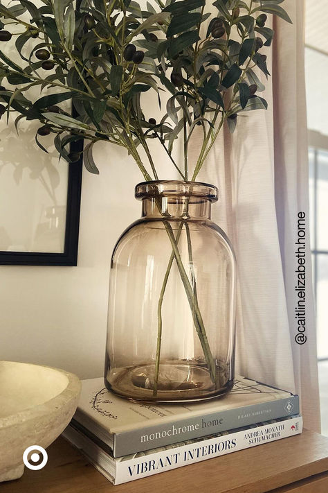 Update any corner of your home with this statement glass vase. The warm, tinted glass is so subtle & versatile, it’ll go with any decor aesthetic. Arrange a faux flower bouquet to instantly liven up any big or small space. Large Glass Vases Decor Ideas, Forest Entryway, Glass Vases Decor Ideas, Small Corner Decor, Vase Decorating Ideas, Brown Glass Vase, Big Vase, Moody Living Room, Glass Vase Decor