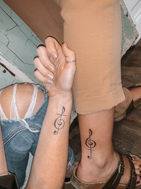 Clef Tattoo Design, Cross And Music Note Tattoo, Treble Clef Tattoo With Flower, Treble Clef And Bass Clef Tattoo, Twins Tattoo, Mother Daughter Music Tattoos, Treble Clef Heart Tattoo, Tiny Treble Clef Tattoo, Best Friend Tattoos Music Notes