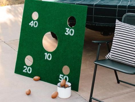 Make a Mini Football Toss Game to Add Some Fun to Any Tailgate | HGTV Corn Hole Trunk Or Treat, Football Trunk Or Treat Ideas, Football Trunk Or Treat, Football Toss Game, Tailgate Activities, Cornhole Scoreboard, Washer Toss Game, Outdoor Party Games, Corn Hole Diy