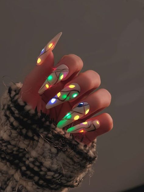 Celebrate the festive season with these unique light-up nails. Featuring a string of colorful lights painted onto a neutral background, this nail design adds a fun and playful touch to your holiday look. Perfect for spreading Christmas cheer with a modern, bold twist. Glow In The Dark Christmas Light Nails, Christmas Nails Glow In The Dark, Light Bulb Nails Christmas, Bold Christmas Nails, Christmas Nails Alternative, Holiday Light Nails, Lime Green Christmas Nails, Xmas Light Nails, Hairstylist Nails Ideas