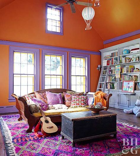 living room with orange walls and purple painted trim accents I have a poem I wrote called "Orange and Purple" - so I was drawn to this room. But I'm not so sure I would ever decorate like this. Creative Playroom Ideas, Fun Playroom Ideas, Pink Playroom, Colorful Playroom, Orange Rooms, Warm Color Schemes, Kids Room Paint, Purple Rooms, Bedroom Orange