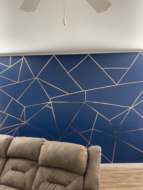 Blue and gold accent wall. Blue/Gold. Blue. Gold Trim. I didn’t think it was possible for me to do it but i did it!!!! Navy Wall With Gold Accents, Navy Blue Wall With Gold Stencil, Navy Blue Bedroom Walls Gold Accents, Bedroom With Blue And Gold Accents, Teal And Gold Accent Wall, Accent Wall With Gold Trim, Blue Gold Room Decor, Accent Walls In Living Room Apartment, Navy And Gold Accent Wall