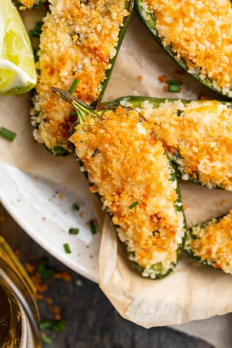 Air Fryer Jalapeño Poppers from 40 Aprons | Cheesy, spicy, crispy, and delicious jalapeño poppers made in the air fryer! This easy appetizer comes together quickly, and in a few simple steps. They're loaded with tangy cream cheese, plenty of cheddar cheese, fresh herbs, spices, and topped off with crunchy breadcrumbs - yum! Healthy Jalapeno Poppers, Jalapeno Poppers Air Fryer, Jalapeño Poppers Air Fryer, Air Fryer Jalapeno Poppers, Cream Cheese Jalapeno Poppers, 40 Aprons, Jalapeno Popper Recipes, Jalapeño Poppers, Poppers Recipe