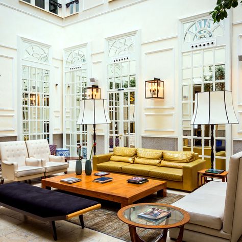 Picture a stately 19th-century palace that’s been transformed into a boutique hotel, one that has everything going for it: old-world glamour, modern interiors by a prominent designer, craft cocktails and charcuterie served in the library, an enviable address in the heart of Madrid’s hip Chueca neighborhood. Digest all of that before we tell you the next part. It’s called Only YOU Boutique Hotel. Madrid Hotels, Cocktails Bar, Hotel Amenities, Colonial Architecture, Luxury Boutique Hotel, Hotel Boutique, Wooden Beams, Room Pictures, Jonathan Adler