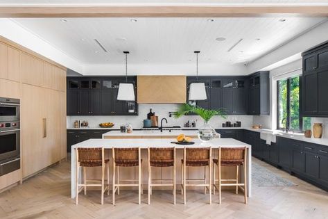 This spacious two-tone kitchen was designed with storage and entertaining in mind. Two marble islands, and double decker upper cabinets offer plenty of space for the homeowners to store kitchenware. | Photographer: Chad Lemmon | Designer: Sacha & Melissa LeClair, LeClair Decor James Charles House, Designs For Kitchen, Leclair Decor, Rustic Kitchens, U Shaped Kitchen, Black Kitchen Cabinets, Kitchen Cabinet Styles, Dark Kitchen, Popular Kitchens