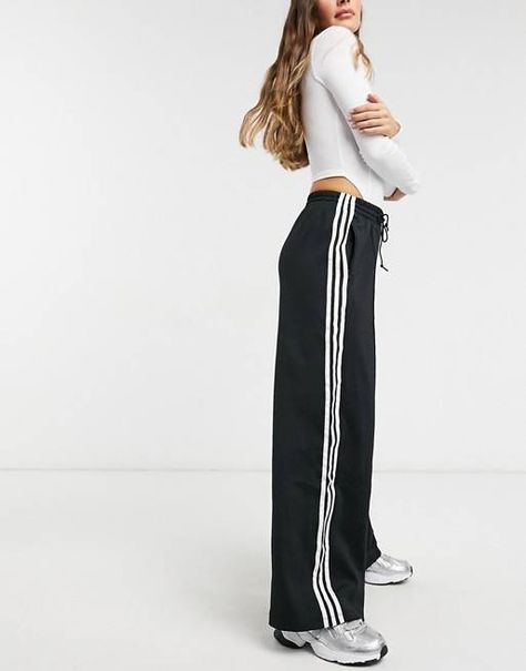 The 17 Best Track Pants That Are On-Trend for 2021 | Who What Wear Sweat Adidas, Adidas Hose, Striped Wide Leg Trousers, Sporty Pants, Pants Adidas, Streetwear Mode, Striped Wide Leg Pants, Pant Trends, Outfit Formulas