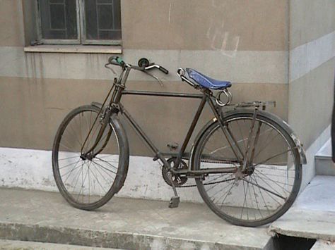 A typical Indian bike in Kolkata, India. These steel-frame Atlas or Hero-brand bicycles are heavy and virtually indestructible. Note the steel brake levers/cables and large springs below the seat. Indian Bike, Indian Cycle, Cycling Adventures, A Typical, My Ride, Kolkata, Steel Frame, Nepal, Springs