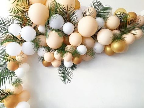 Neutral color palette - blush/peach, white, gold and palm leaves tucked in between.   Photo Credit: Wild Child Party Balloon Arrangement, Balloon Arrangements, Tropical Party, Wild Child, Baby Party, Balloon Arch, Balloon Garland, Home Fashion, Party Balloons