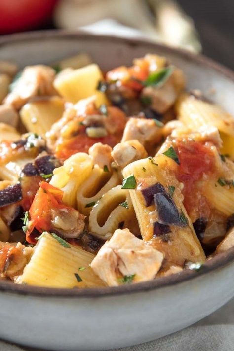 Pasta With Swordfish, Tomato, and Eggplant (Rigatoni Con Pesce Spada) Recipe | On the southern Italian island of Sicily, seafood reigns supreme—as do tomatoes, and eggplant. In this summery pasta, all three of those Sicilian stars come together for an easy, hearty, yet still light dish. Choose your ingredients well—poor-quality ones will fall flat in a pasta recipe as simple as this. #pasta #pastarecipes #pastadishes #seriouseats #recipes Swordfish Pasta Recipe, Swordfish Pasta, Sicilian Swordfish, Pasta With Eggplant, Eggplant And Tomatoes, Lobster Restaurant, Italian Seafood, Italian Feast, Fish Pasta