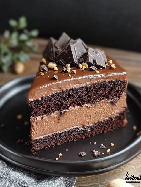 Chocolate Mousse Cake    🍫 𝗜𝗻𝗴𝗿𝗲𝗱𝗶𝗲𝗻𝘁𝘀 🍫 280g all-purpose (plain) flour  250g granulated sugar 🍬 35g cocoa powder 🍫 1.5 tsp baking soda 🥄 ½ tsp salt 🧂 200ml hazelnut milk, warm 🥛 100ml strong brewed coffee ☕ 1.5 tbsp apple cider vinegar 🍎 120g vegetable oil 🌻 300g silken tofu 🌿 350g dark chocolate, chopped 🍫 200g Vego hazelnut spread 🌰 150ml hazelnut milk (or other plant milk) 🥛 Pinch of salt 🧂 100g chocolate 🍫 80ml plant milk (or cream) 50g chopped, toasted hazelnuts Hazelnut Chocolate Cake, Hazelnut Mocha Cake, Chocolate Hazelnut Ganache, Vegan Chocolate Hazelnut Cake, Flourless Chocolate Hazelnut Cake, Chocolate Hazelnut Cake, Hazelnut Milk, Plant Milk, Silken Tofu