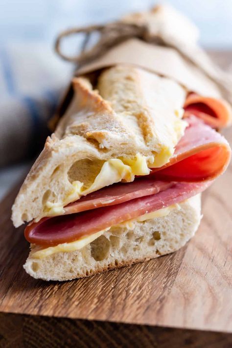 More than 3 million Jambon-Beurre sandwiches are sold in France every day! And for good reason, they're delicious! They're also easy to make at home with this simple recipe and just 3 top quality ingredients: ham (ideally Paris ham), European style butter and a fresh baguette! Ham Baguette Sandwich, French Style Sandwich, French Ham Sandwich, Baguette Sandwich Ideas Simple, European Lunch Ideas, Jamon Recipes, Parisian Sandwich, Ham And Butter Sandwich, French Sandwiches